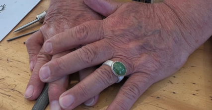 Te Wāhi Toi - Full Day Jewellery course learning how to cut a piece of Green Stone and set it in silver. 